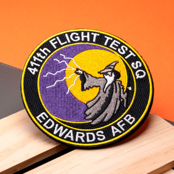 Embroidered 411th Flight Test SQ Edwards AFB patch featuring a wizard throwing a lightning bolt against a purple and yellow moon.