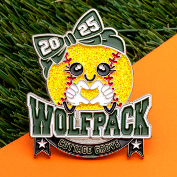 Softball lapel pin featuring a yellow glitter softball with a green bow and the text Wolfpack Cottage Grove 2025.