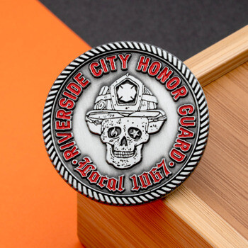 Circular challenge coin featuring a skull wearing a firefighter helmet with red text for Riverside City Honor Guard Local 1067 and a rope border.